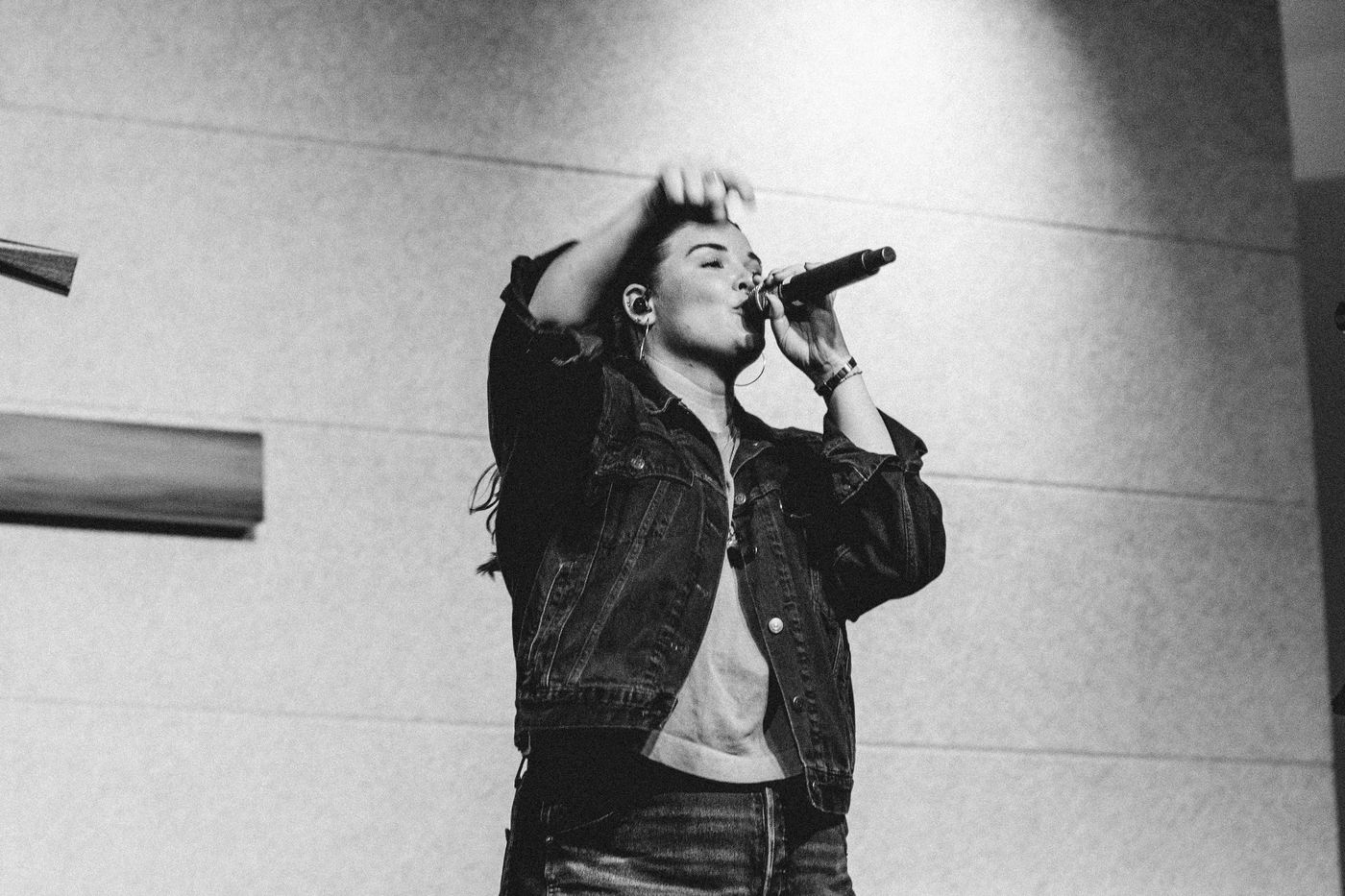A singer at the microphone, in black and white